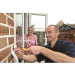 Image of lady and person doing handywork